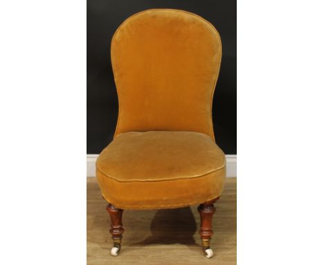A Victorian drawing room chair, stuffed-over upholstery, turned forelegs, ceramic casters, 92.5cm high, 53cm wide, the seat 4