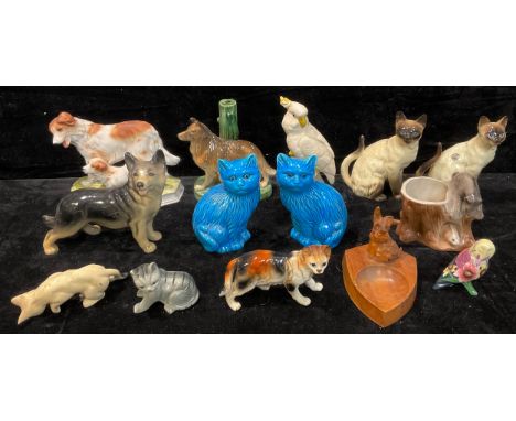 A collection of ceramic animal models including a Cooper cat, a Tupton Ware owl, a pair of Chinese blue glazed cats, etc; a c