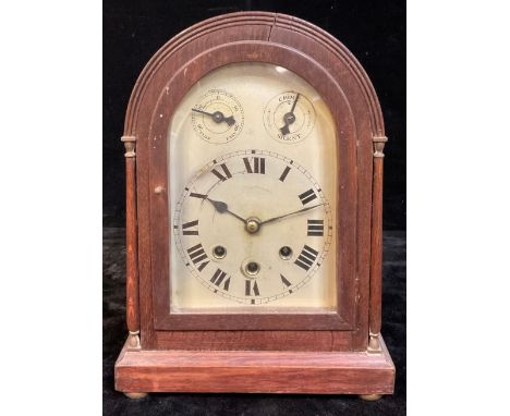 A German Württemberg oak chiming mantel clock, domed case with columnar supports, moulded rectangular base, brass bun feet, s