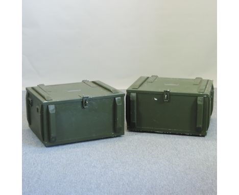A green painted and metal bound military trunk, bearing a label 'lighting kit 3hw', together with another, each 75cm
