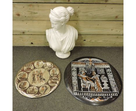 A cream painted reconstituted stone portrait bust of a young lady, 50cm tall, together with a pair of Indian metal wall plate