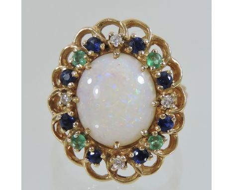 A 9 carat gold, opal and gem set ring, boxed 