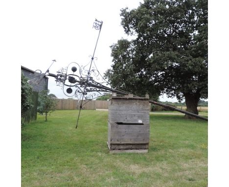 A large painted iron weather vane, approximately 850cm tall overall.  This weather vane was made by Don Bailes from Northwold