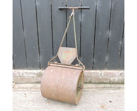 A small iron garden roller 
