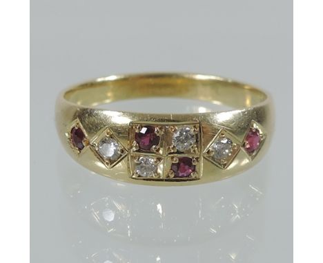 An 18 carat gold, ruby and diamond ring, boxed 