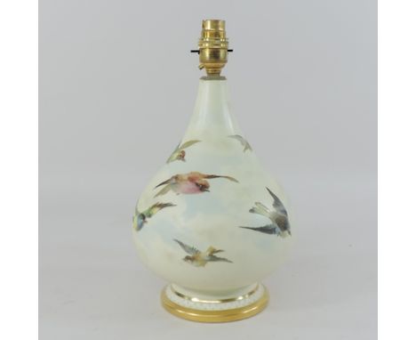 An early 20th century Royal Worcester blush ivory porcelain table lamp, 32cm tall