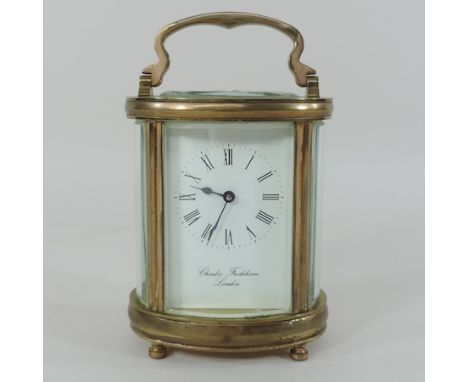 A brass cased carriage clock, signed Charles Frodsham, London, 11cm tall 