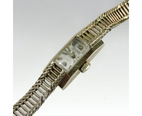 A 1950's Rotary 9 carat gold cased ladies wristwatch, with a pierced flexible strap and hinged clasp