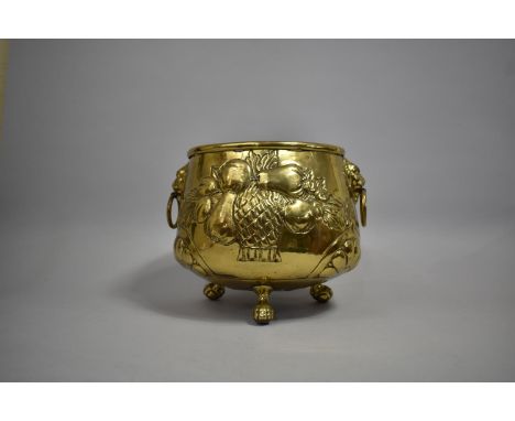 A Nice Quality Brass Plant Pot Holder with Lion Mask Handles and Three Claw and Ball Feet, Repousse Work Decoration in the Fo