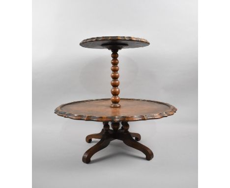 An Edwardian Oak Two Tier Lazy Susan with Bobbin Support, 43cm high 