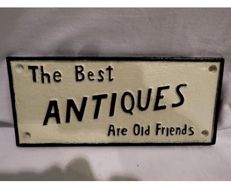 Cast iron sign The Best Antiques Are Old Friends, L: 24 cm. UK P&amp;P Group 1 (£16+VAT for the first lot and £2+VAT for subs