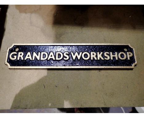 Cast iron Grandads workshop sign. W:18cm. UK P&amp;P Group 1 (£16+VAT for the first lot and £2+VAT for subsequent lots) 