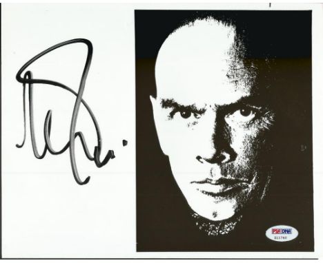 Yul Brynner signed photo. Black and white 8x10 portrait photo with a large white space to the left signed clearly and boldly 