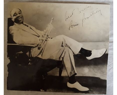 Louis Armstrong signed vintage 6 x 6 inch black and white photo, autograph a little light and a bit scruffy on edges which co