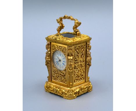 A Cast Brass French Style Miniature Carriage Clock, the enamel dial with Roman and Arabic numerals and with lever escapement 