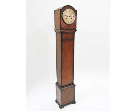 A 1930s oak granddaughter clock with silvered Arabic dial, enclosing a 'Coronet' movement H134cm