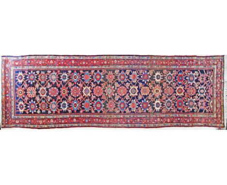 A Persian Kashan corridor carpet c1930s, 350X115cm.