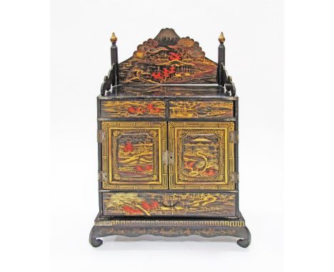 A Japanese small commode on stand, decorated with chinoiseries. H71cm.