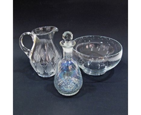 A collection of crystal table-ware, comprising a decanter with stopper, a pitcher H21cm and a large bowl. (3)