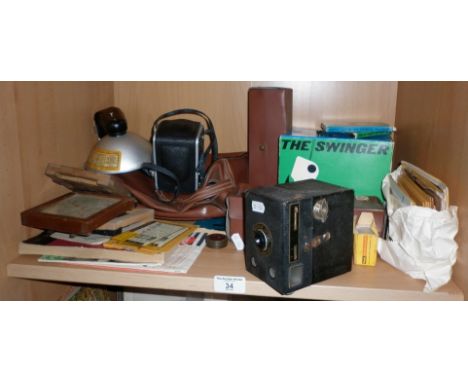 Cameras and accessories including The Swinger polaroid camera in original box
