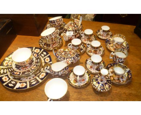 Extensive Royal Crown Derby Imari pattern tea set, inc. teapot, sugar bowl and milk jug, cups and saucers and coffee cans, et