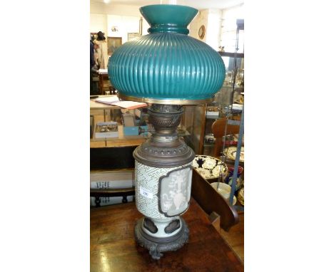 Victorian oil lamp with porcelain and brass reservoir with green glass shade (crack to glass)