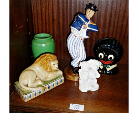 Sailor dancing the hornpipe hand-painted ceramic figure, Staffordshire style lion, Golly money box and antique German? porcel