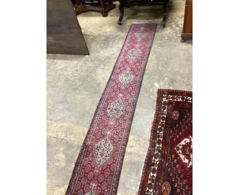A North West Persian red ground runner, 366 x 55cm