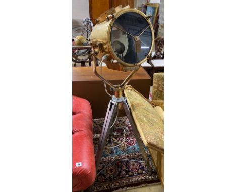 A vintage style brass spotlight floor lamp on tripod stand, height 152cm