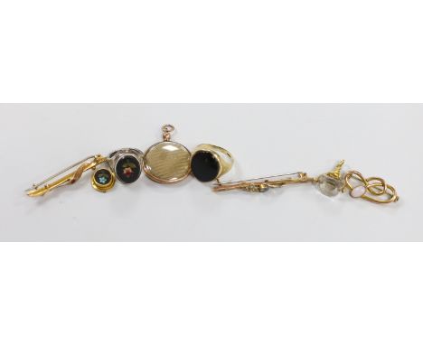 A Victorian yellow metal mounted rock crystal fob seal, 21mm, two yellow metal bar brooches including 9ct gold, an Edwardian 