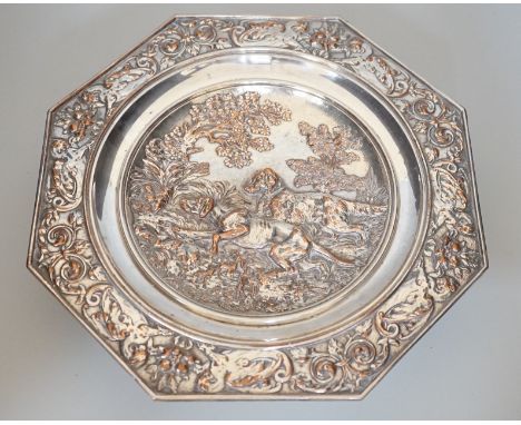 An early 20th century Elkington type silver plated tazza embossed with hunting dogs, 29cm