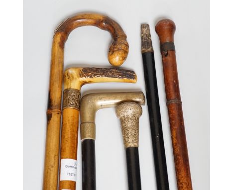 Two Victorian silver mounted walking sticks, a sword stick and three other sticks (6)