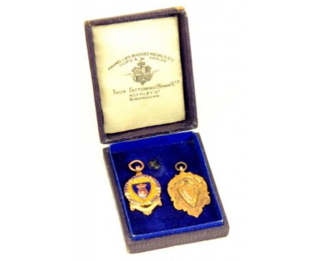 SOCCER.  A 9CT GOLD AND ENAMEL D & DFS SENIOR WINNERS MEDAL 1922, BIRMINGHAM 1921 AND A 9CT GOLD SHIELD MEDALLION, 10.6G