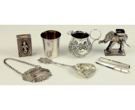 MISCELLANEOUS SMALL SILVER WORKS OF ART, INCLUDING AN INDIAN SILVER MINIATURE MODEL OF AN ELEPHANT, A CADDY SPOON, WINE LABEL