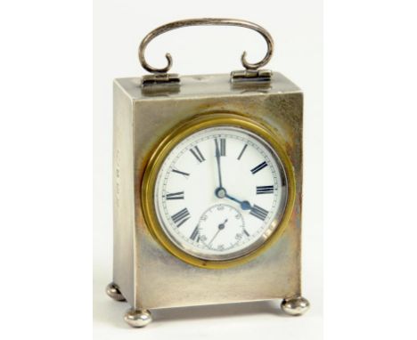 A GEORGE V SILVER MINIATURE CLOCK, THE LEVER TIMEPIECE WITH ENAMEL DIAL, BIRMINGHAM 1915