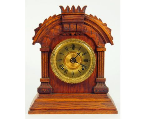 AN AMERICAN ARCHITECTURAL CARVED SOFTWOOD MANTLE CLOCK WITH GONG STRIKING MOVEMENT, CIRCA 1890 
