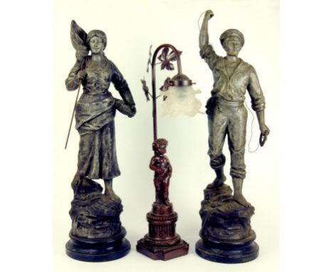A PAIR OF FRENCH FIN DE SIECLE SPELTER FIGURES OF A SAILOR AND FISHERGIRL AND A REPRODUCTION SPELTER FIGURAL LAMP