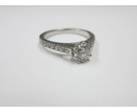 A DIAMOND SOLITAIRE RING WITH DIAMOND SHOULDERS in platinum, size H Sold with GIA Report: 0.50ct, E colour, clarity VVS1