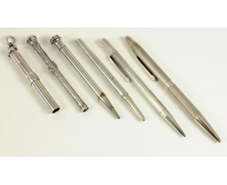 A SILVER BALLPOINT PEN AND A PROPELLING PENCIL BOTH ENGINE TURNED AND FOUR EARLIER SILVER PENCILS