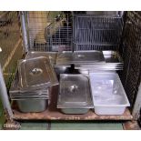Various catering equipment steel trays with lids, racks