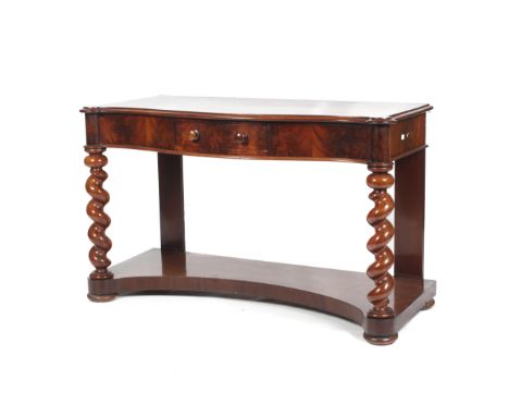 A Victorian mahogany serpentine shaped console hall table. With frieze short drawer and heavily turned barley twist front col