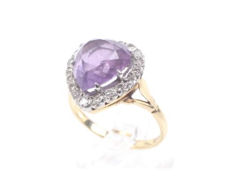 A vintage gold, amethyst &amp; diamond heart-shaped cluster ring, Centred with a heart-shaped amethyst approx. 11.5mm x 10.3m