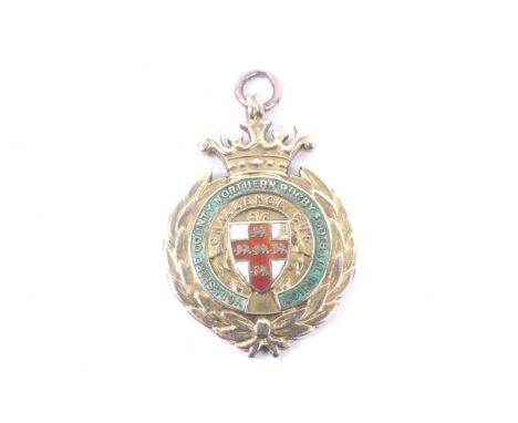An early 20th century 15ct gold and polychrome enamel 'Northern Rugby Union' medallion. Awarded to 'Leeds Yorkshire Cup Winne