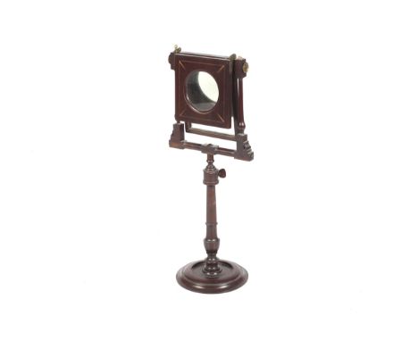 A Victorian mahogany zograscope. With fine satinwood and ebony inlays, on a turned support and round foot. H63cm.A zograscope