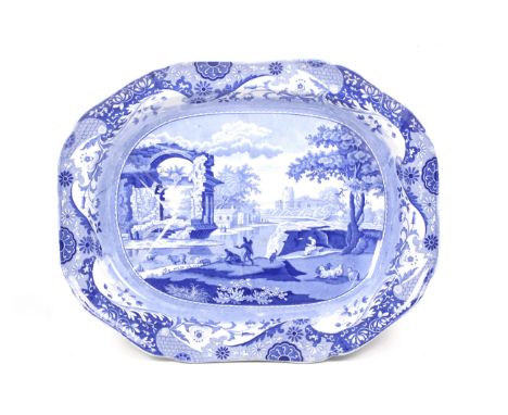 A large 19th century Spode meat platter (tree and well) decorated in the Italian pattern. With scalloped edge, raised on two 