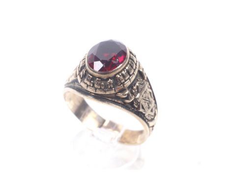 A vintage Canadian gold and synthetic-ruby high school graduation ring, 1976 from the Monsignor Harold Doran High School, Mon