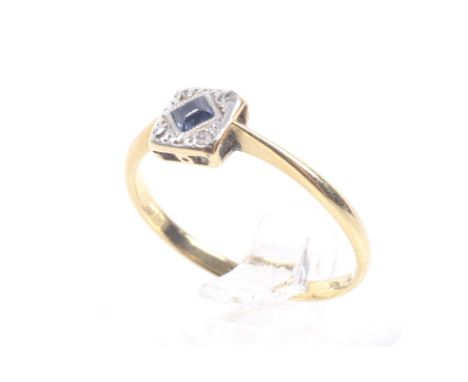 An Art Deco gold, sapphire and rose diamond square cluster ring. Centred with a square step-cut sapphire within a rose diamon