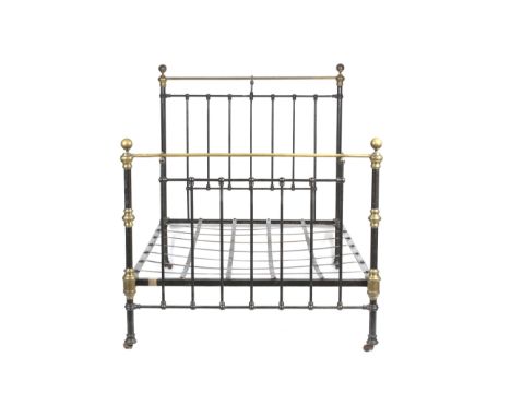 A Victorian brass and iron bed. With side rails, head and foot gate W137cm