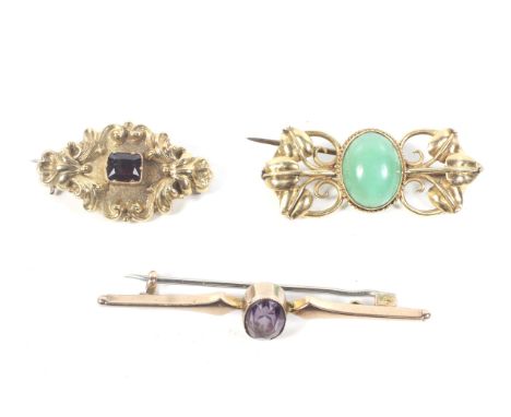 Three Victorian and later gold and gem set brooches. Comprising; an oval cabochon chrysoprase approx. 12.5mm x 10mm, rub-over