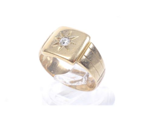 An early 20th century gold and diamond square signet ring. The square head star-gypsy set with a small old-cut diamond, on a 